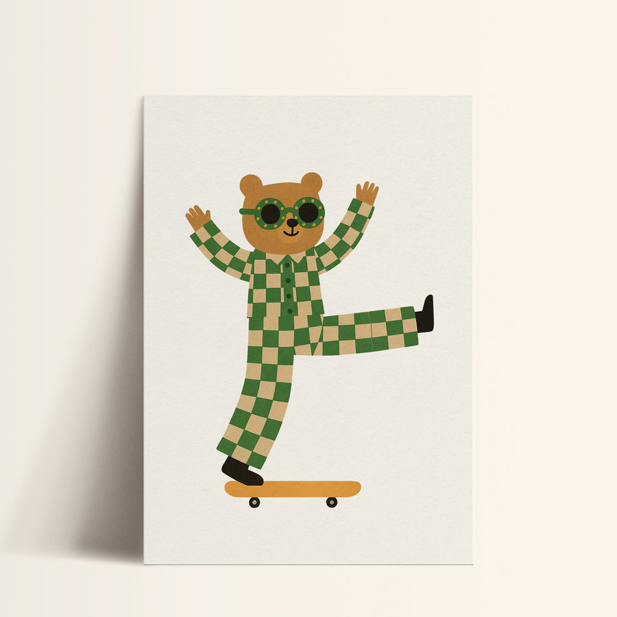 a card with a teddy bear on a skateboard
