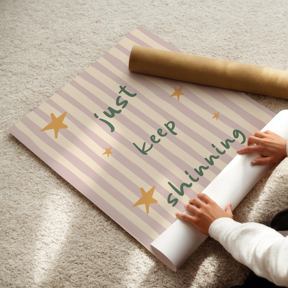 a child is holding a roll of paper with writing on it