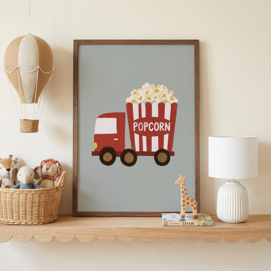 a framed poster of a red and white popcorn truck, a basket of stuffed animals, and a lamp on a shelf.