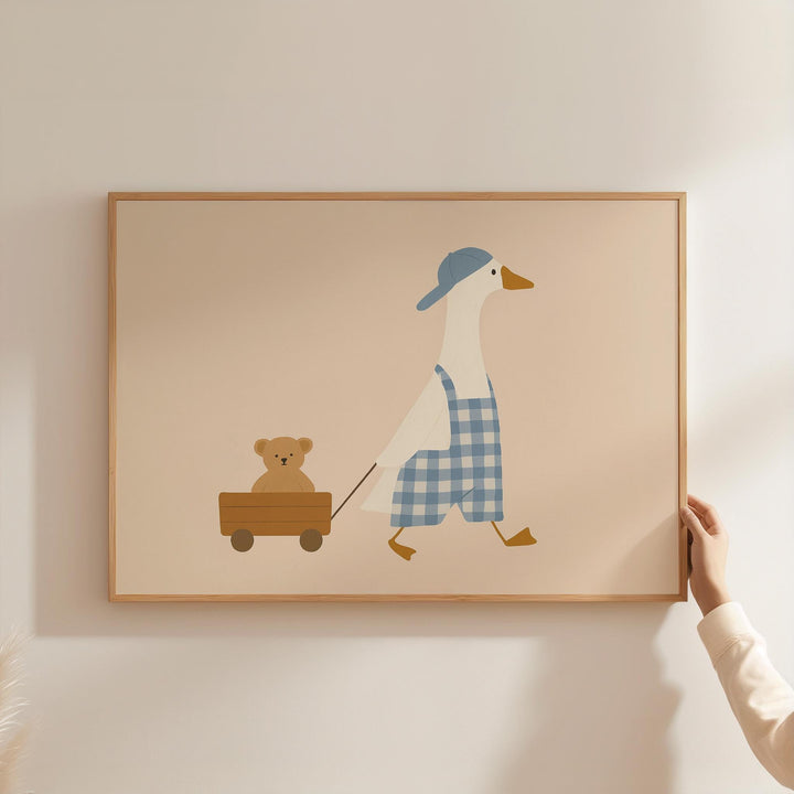 a person holding a picture of a duck and a teddy bear
