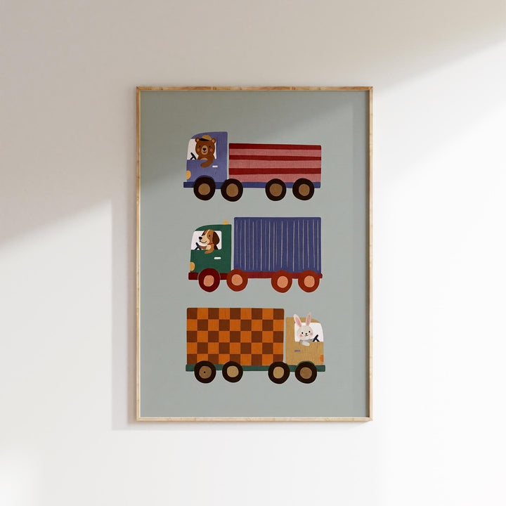 The image is a framed illustration of three colorful toy trucks, each with a different design and color scheme.