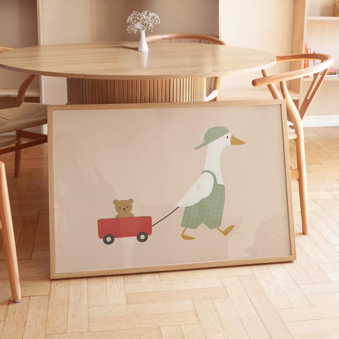 a picture of a duck pulling a teddy bear on a wagon