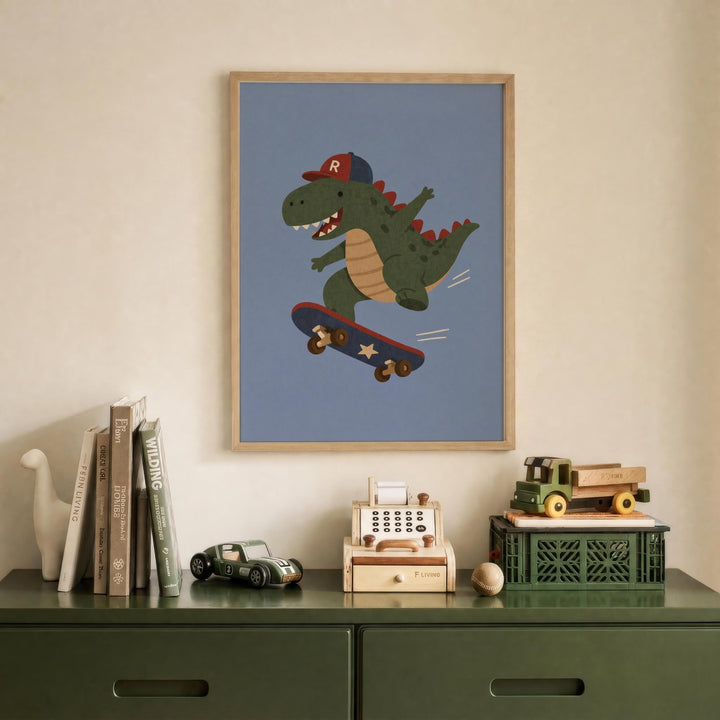a framed illustration of a dinosaur riding a skateboard, displayed on a wall above a green dresser with various toys and books on it.