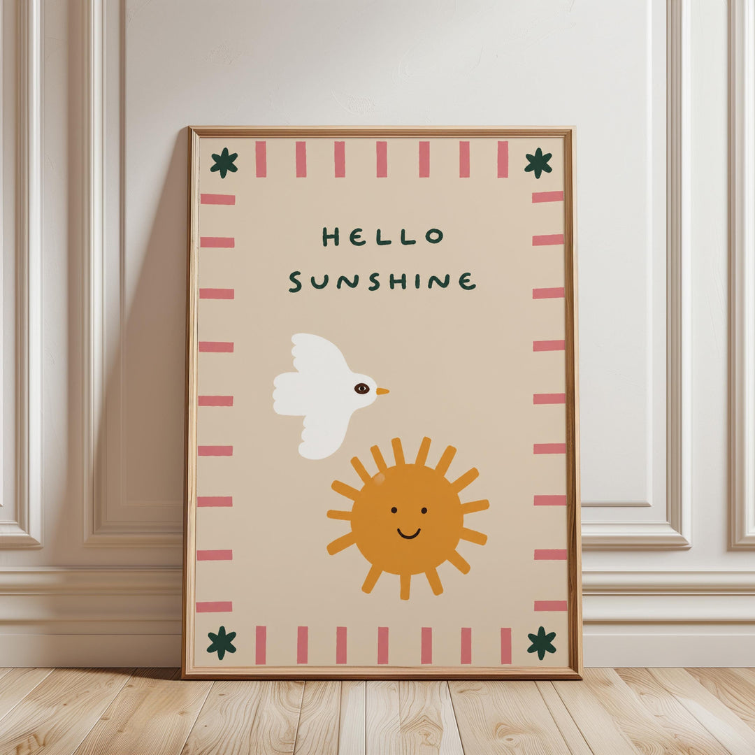 A framed poster with a cheerful design featuring a bird, a sun, and the text "Hello Sunshine".