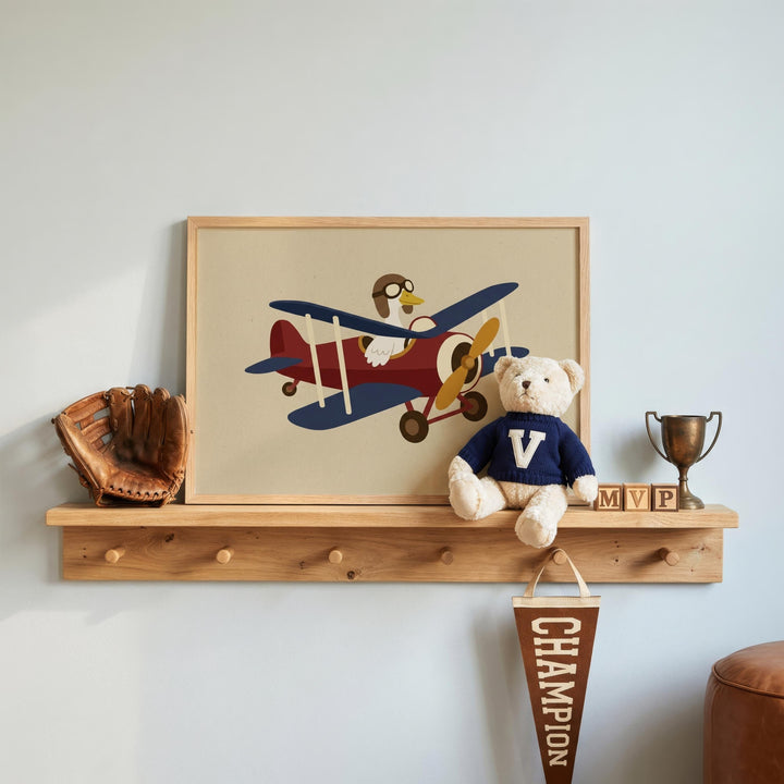 a shelf with a framed picture of a red, white, and blue airplane, a teddy bear, a baseball glove, and a trophy.