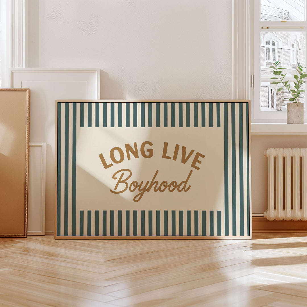 a long live boyhood sign sitting on a hard wood floor