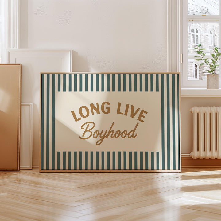 a long live boyhood sign sitting on a hard wood floor