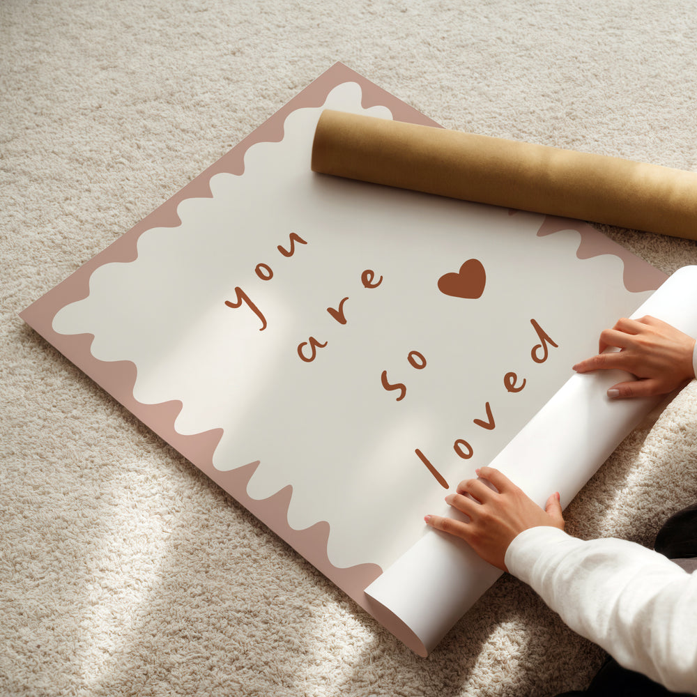 a person is holding a roll of paper with a message on it