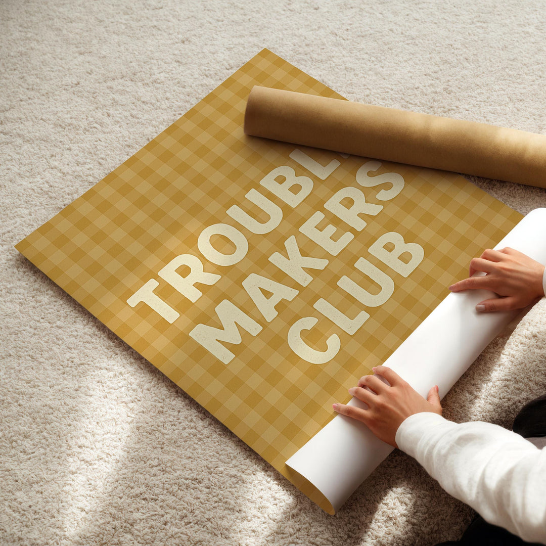 a person laying on the floor with a roll of paper