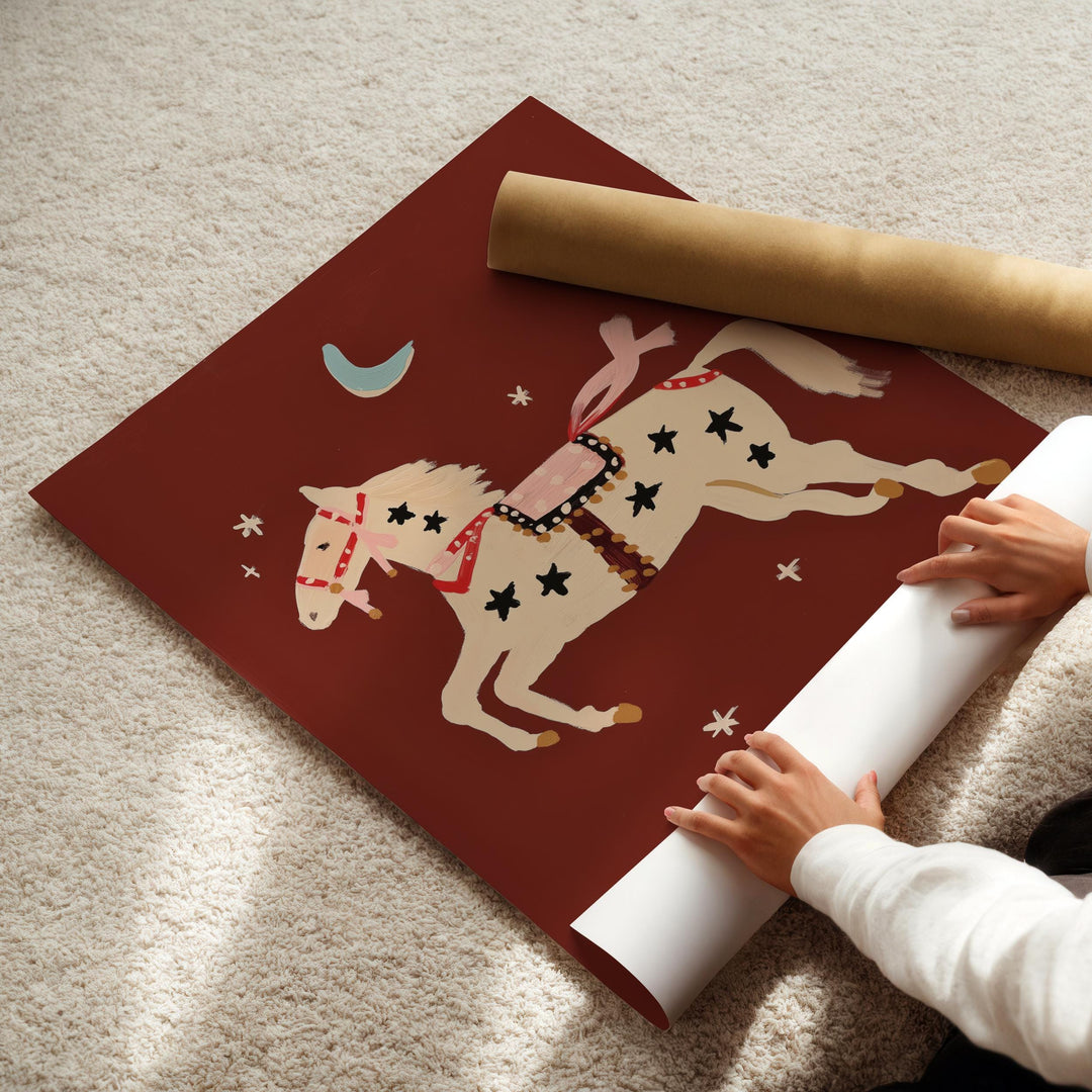 a child is playing with a paper horse