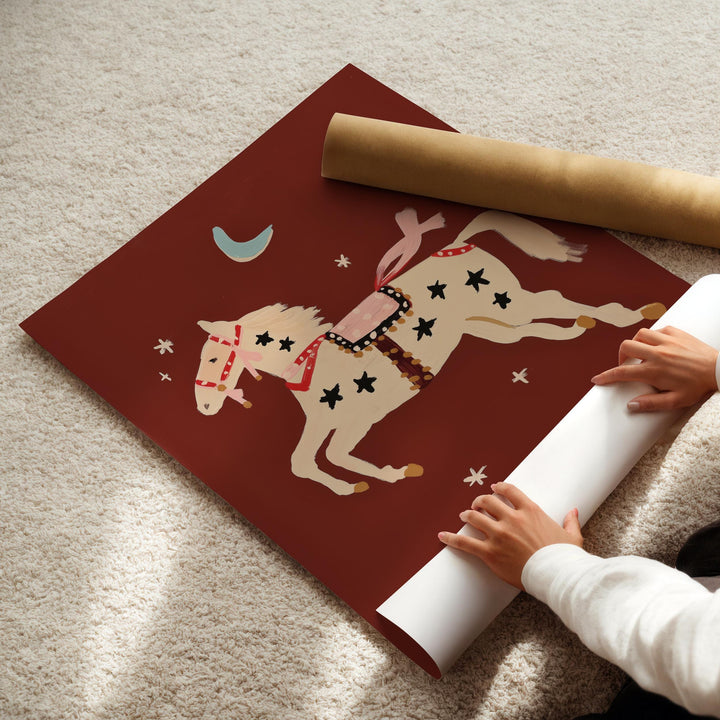 a child is playing with a paper horse