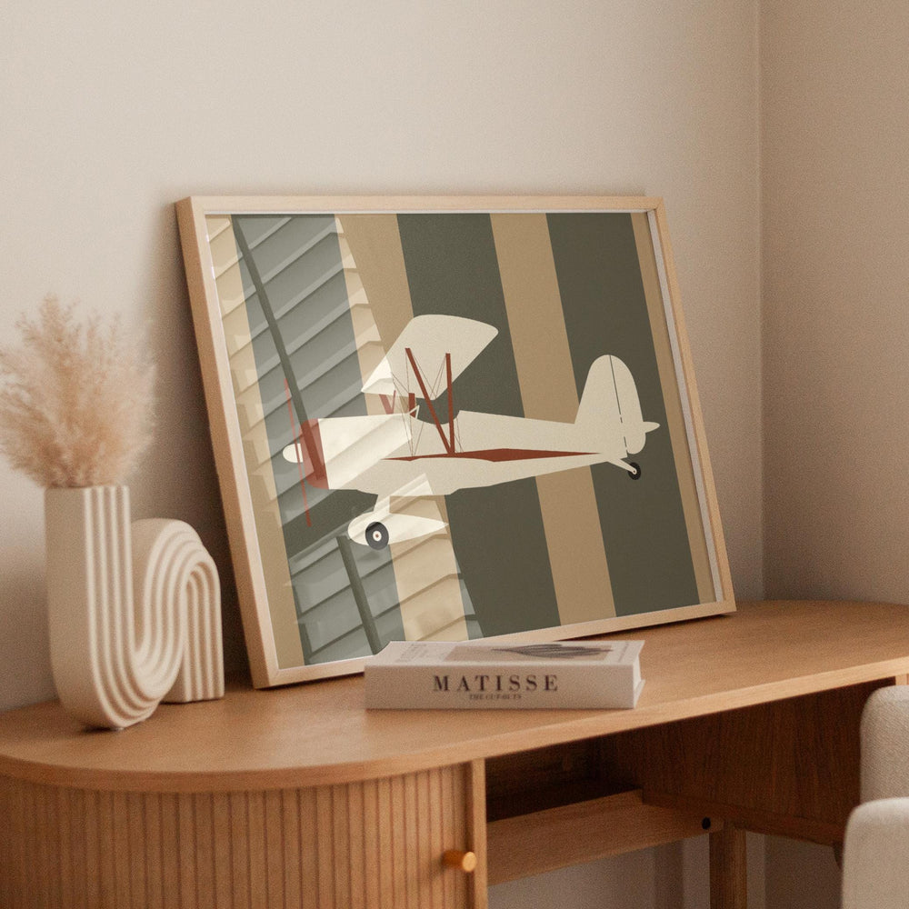 a picture of a plane on a table next to a book