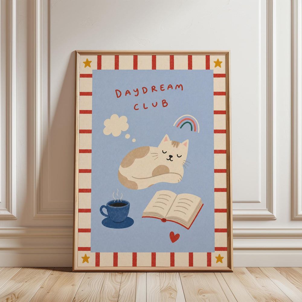 The image is a framed poster with a cat sleeping, a cup of coffee, and a book, all set against a blue background with a red and white border.