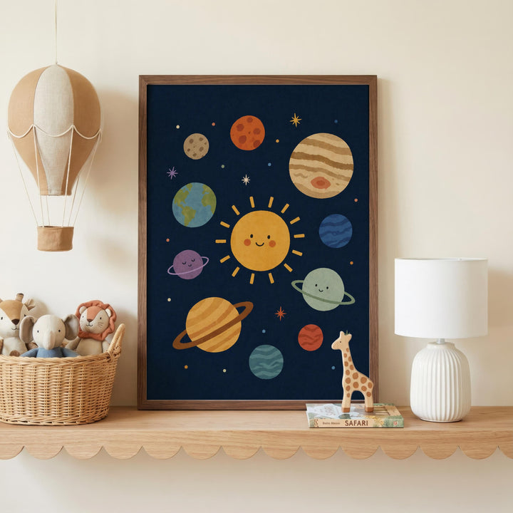 a framed poster of a solar system with planets and a smiling sun, displayed on a shelf next to a basket of stuffed animals and a lamp.