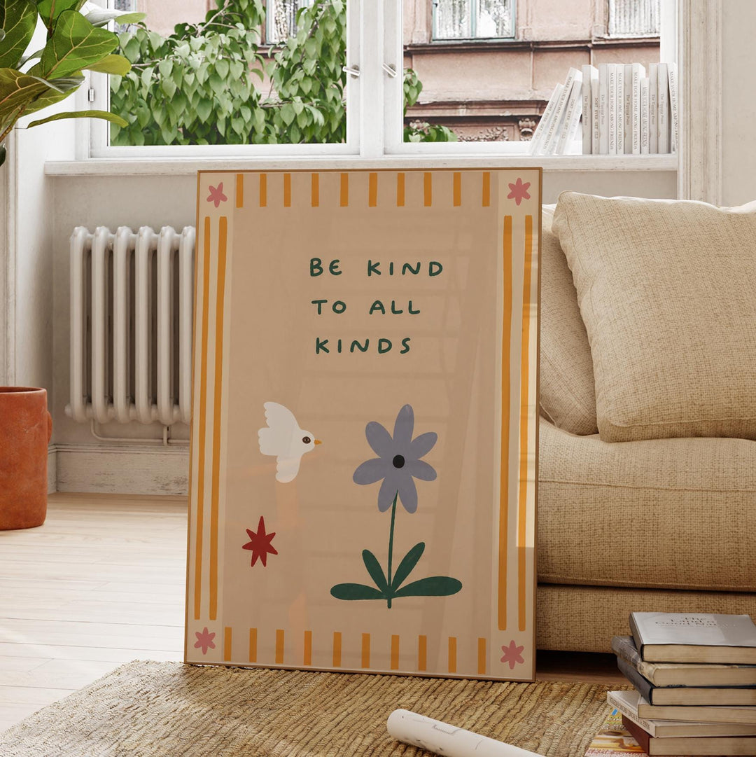a poster with a message encouraging kindness to all kinds, placed on a rug in a room with a window and a couch.