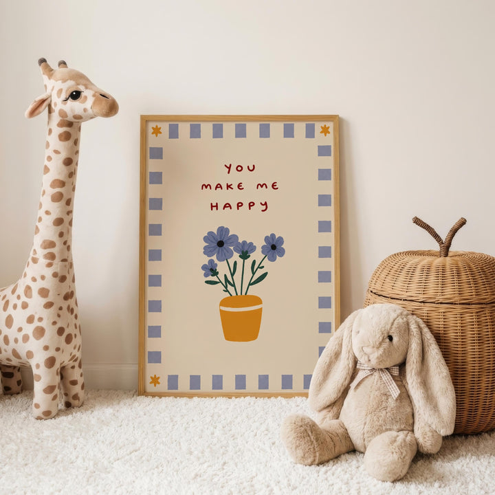 A giraffe toy stands next to a framed picture with a floral design, and a stuffed rabbit toy is sitting on the floor in front of the picture.
