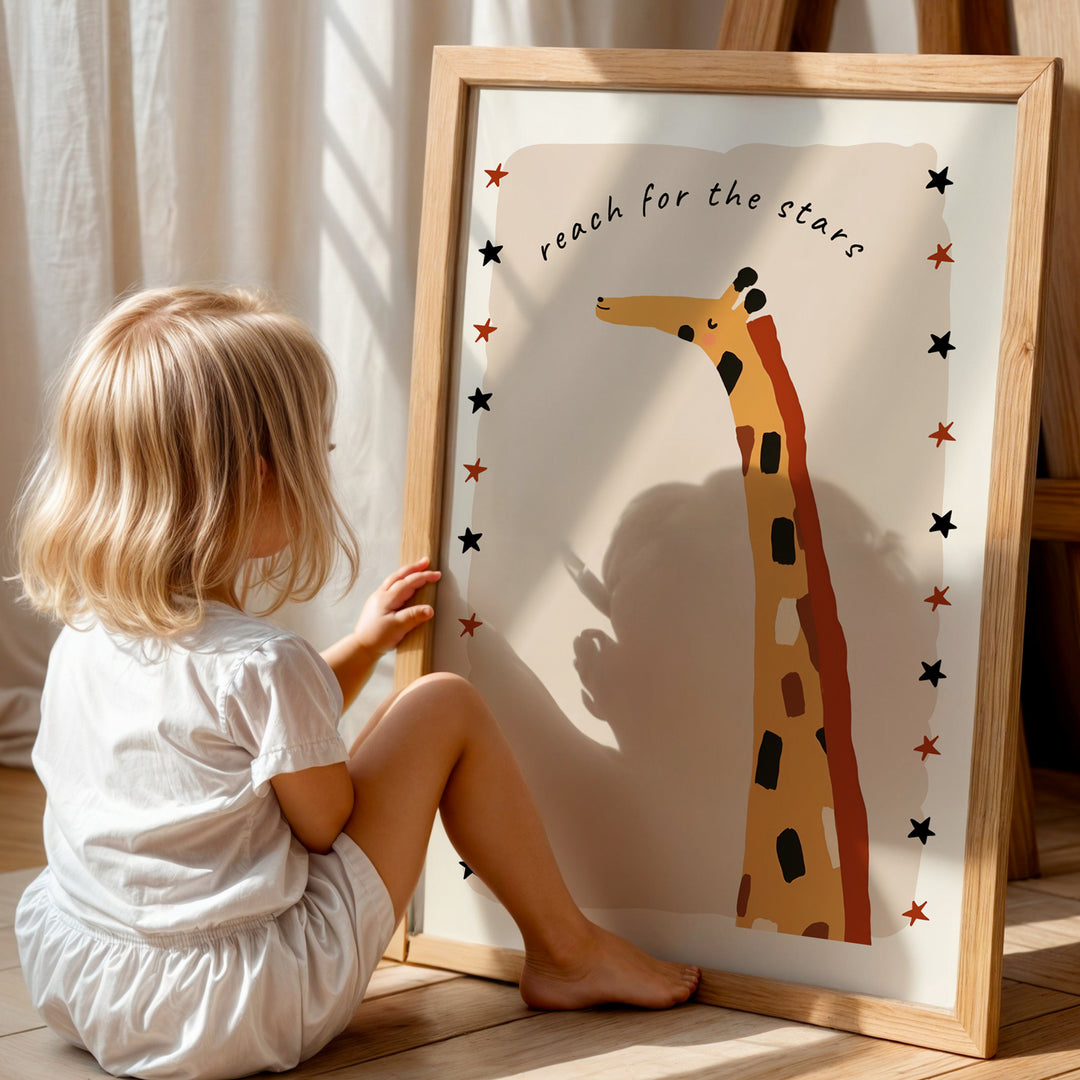 a little girl sitting in front of a picture of a giraffe