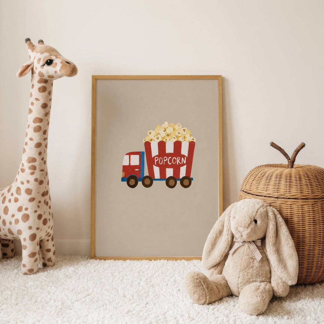 a giraffe, a rabbit, and a wicker basket, all placed on a white carpet. In the center of the image is a framed picture of a red and white truck with a red and white striped bucket labeled "POPCORN".