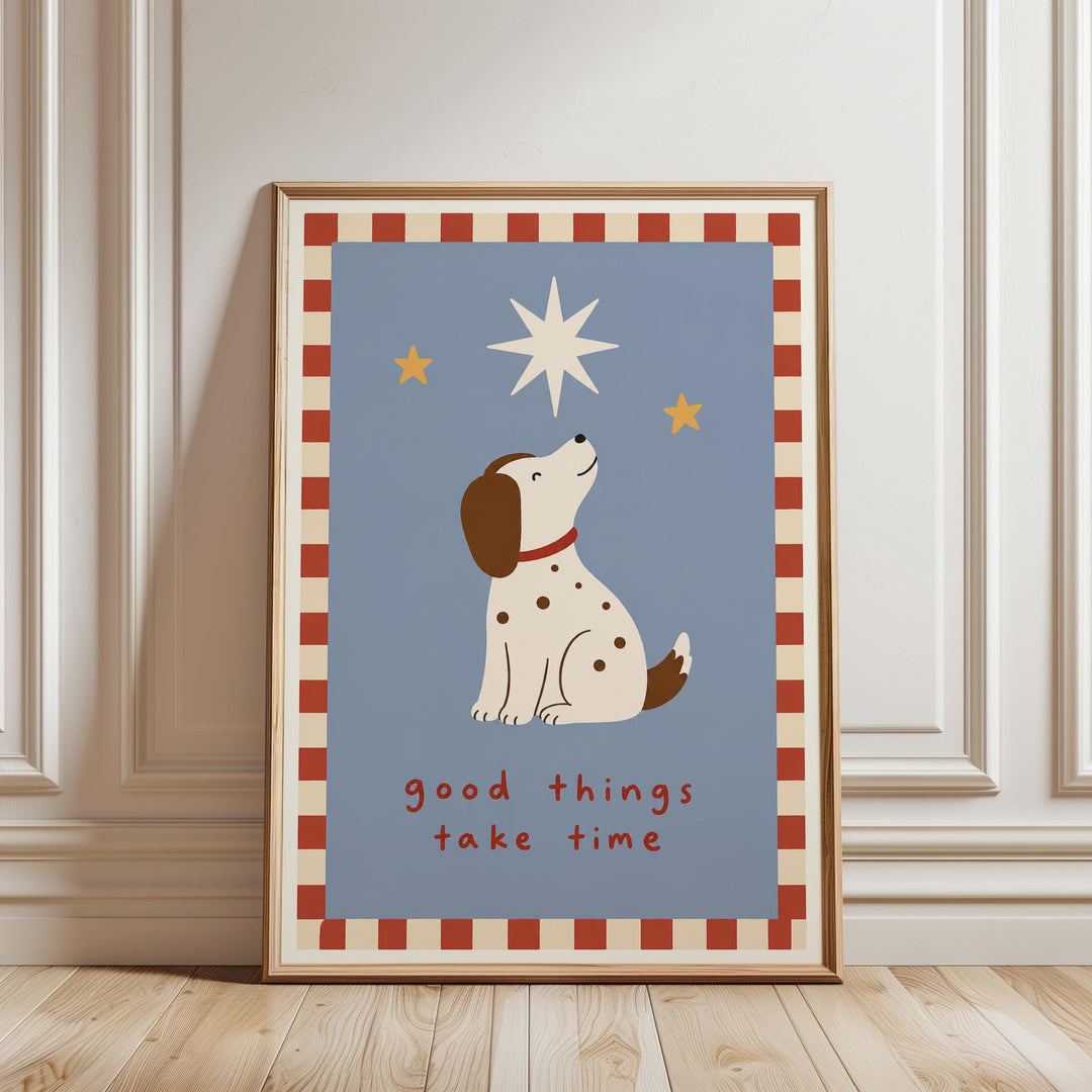 A framed poster with a cartoon dog looking up at the stars, accompanied by the text "Good things take time".