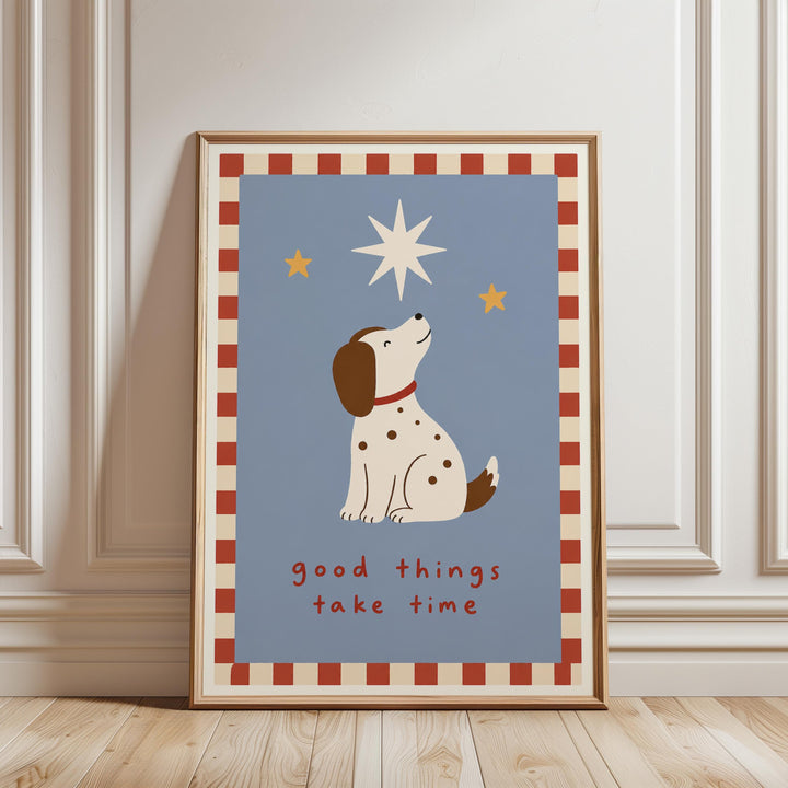 A framed poster with a cartoon dog looking up at the stars, accompanied by the text "Good things take time".