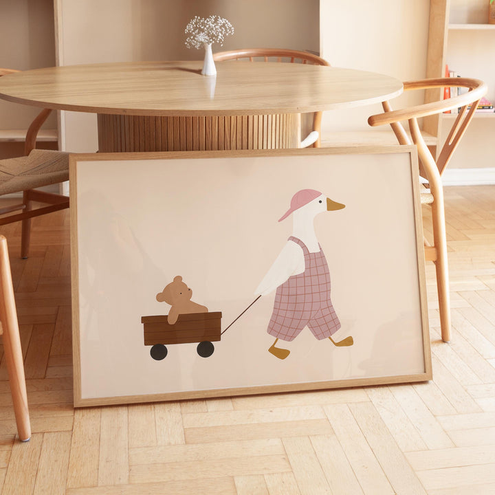 a picture of a duck pulling a teddy bear on a wagon