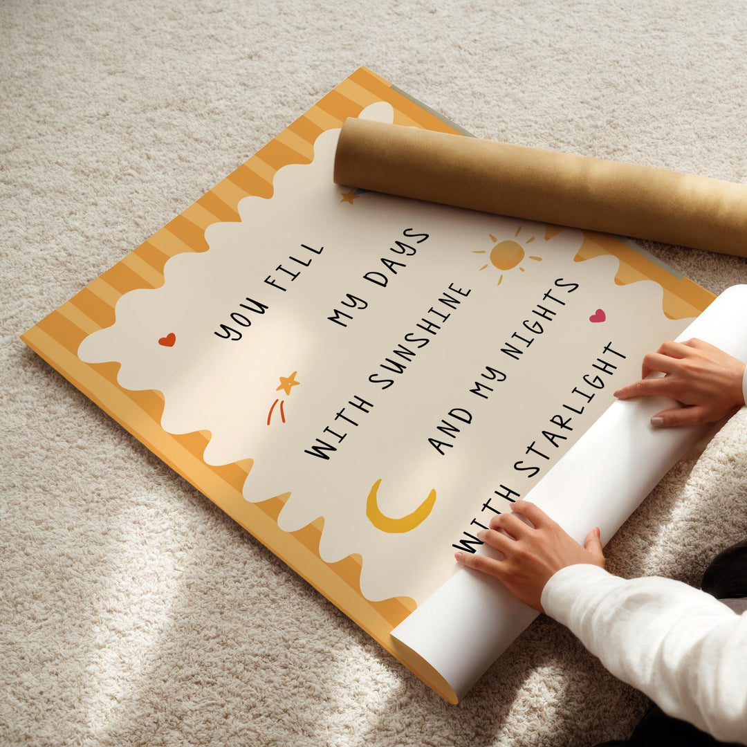 a child is holding a sign on the floor