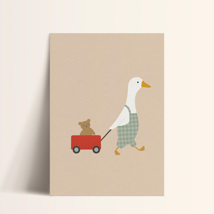 a duck pulling a wagon with a teddy bear on it