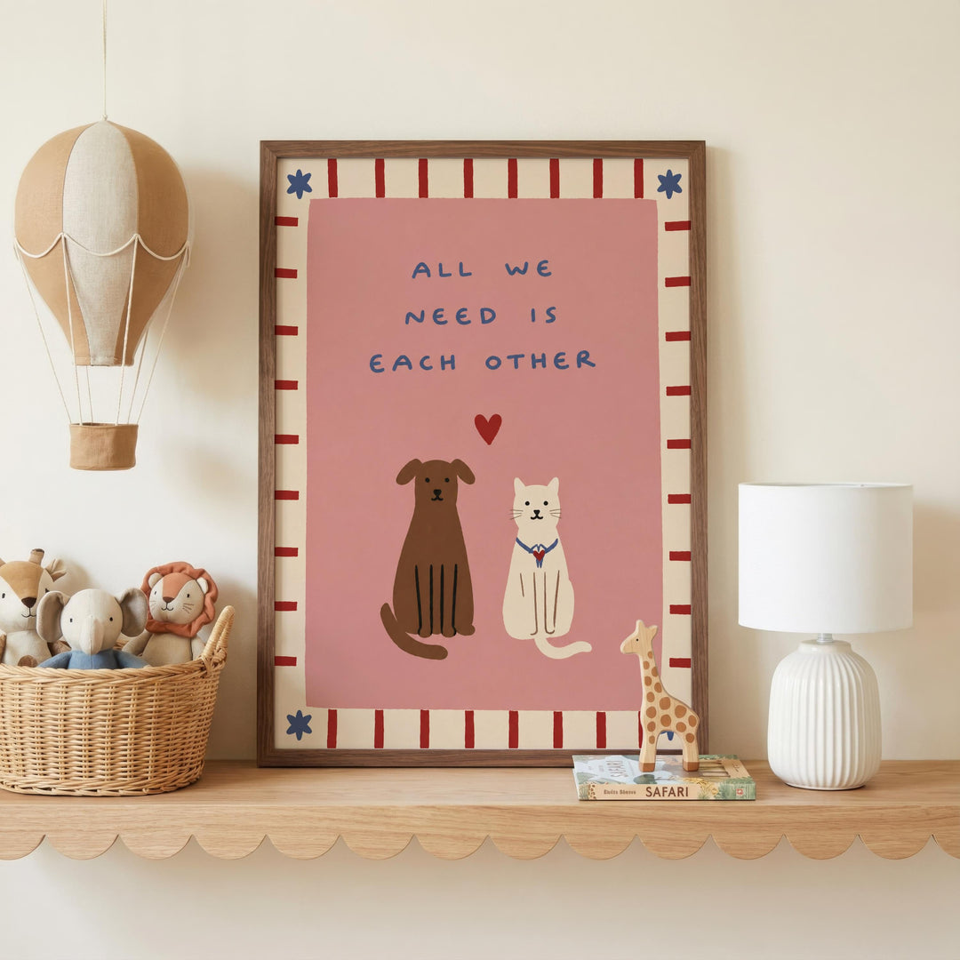 a framed poster with a message about the importance of each other, accompanied by illustrations of a dog, cat, and giraffe. The poster is displayed on a shelf, with a basket of stuffed animals and a lamp nearby.