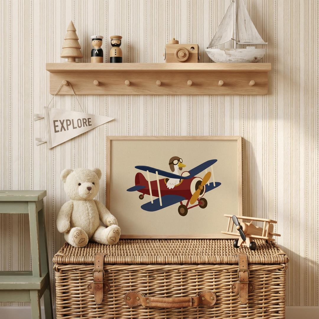 a wooden shelf with various toys and a framed picture of a teddy bear and a plane, along with a small wooden boat and a "EXPLORE" banner.
