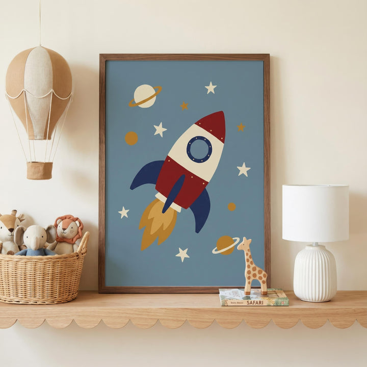 a framed picture of a rocket ship with a planet and stars in the background, placed on a shelf next to a lamp and a basket of stuffed animals.
