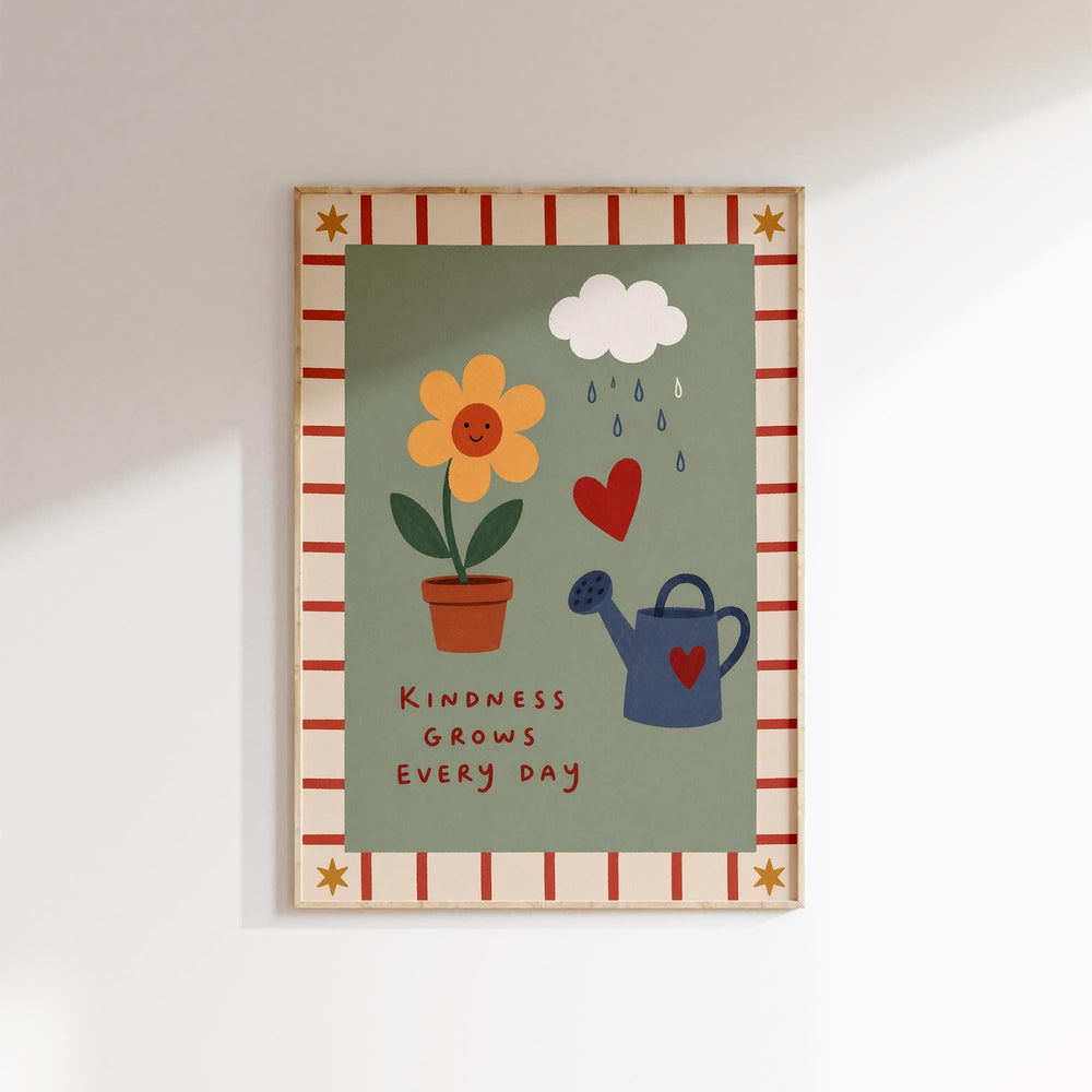 The image is a framed poster with a green background and a red and white border. It features a yellow flower, a blue watering can, and a heart symbol. The poster also includes the text "Kindness grows every day" at the bottom.