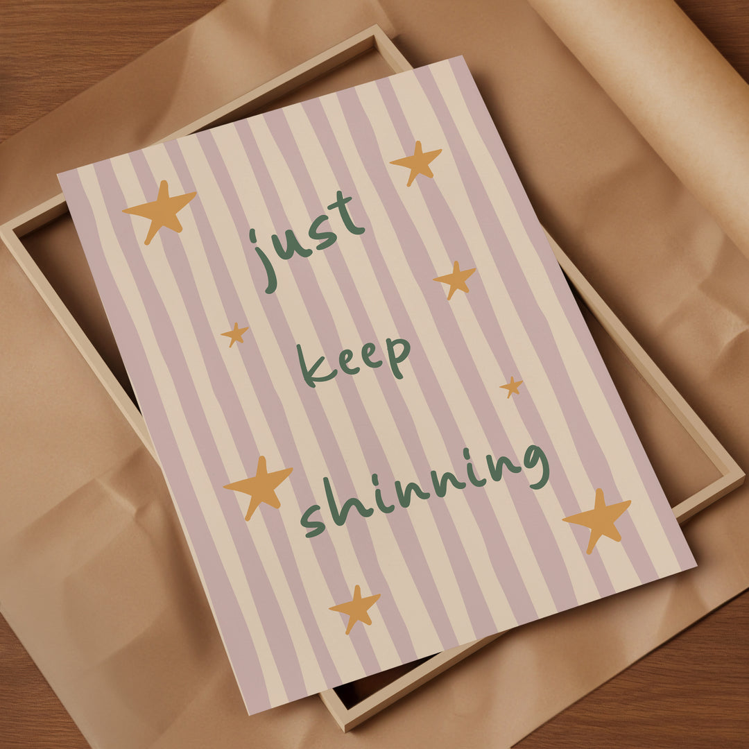 a card that says just keep shining on it