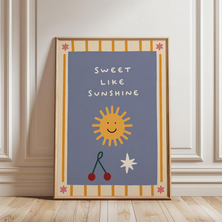 a framed poster with a cheerful design, including a sun, cherries, and a star, along with the text "Sweet like sunshine".