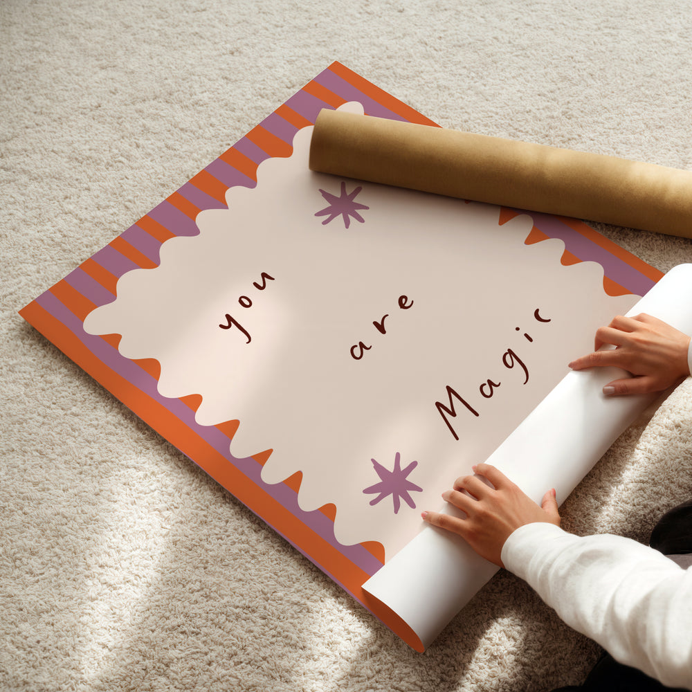 a child is holding a roll of paper with a message on it