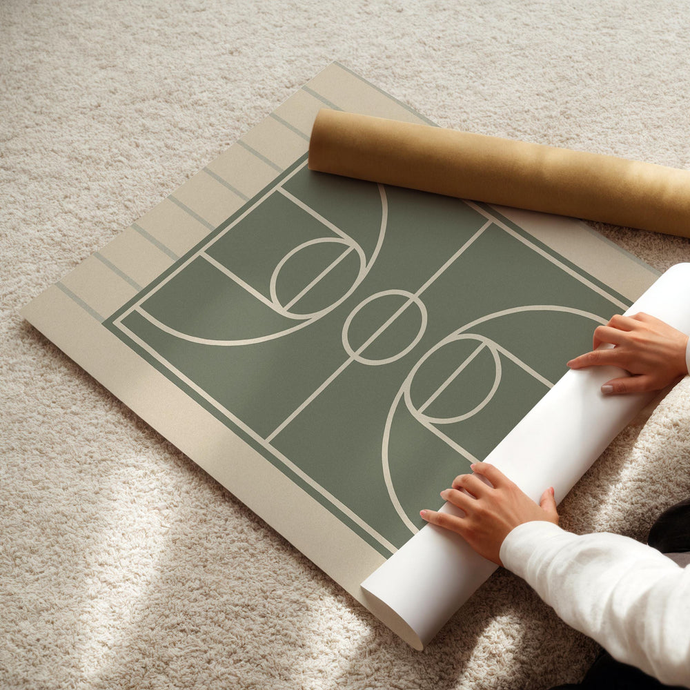 a person laying on the floor with a roll of paper
