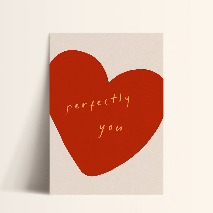 a red heart with the words perfectly you written on it