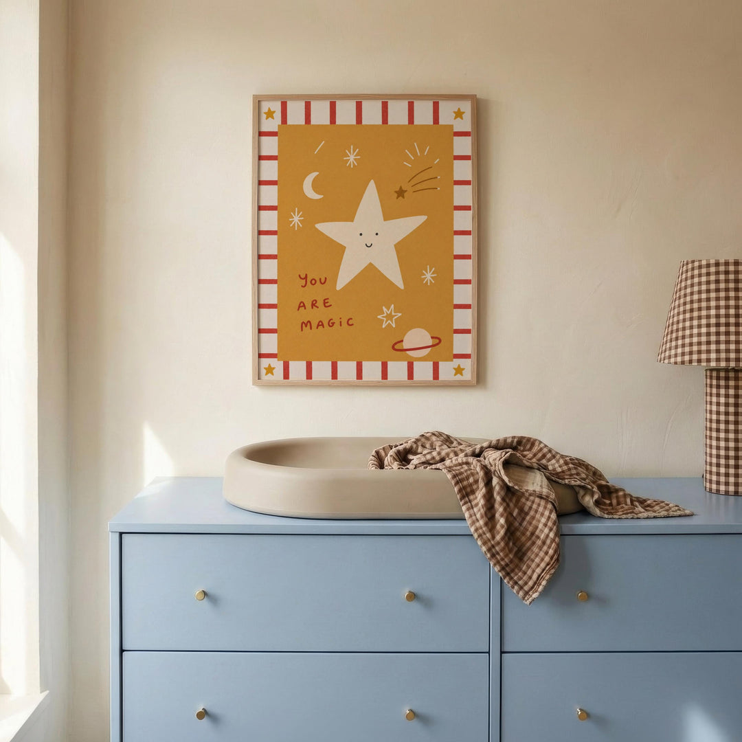 a blue dresser with a white sink on top, and a framed poster with a star and text above it.