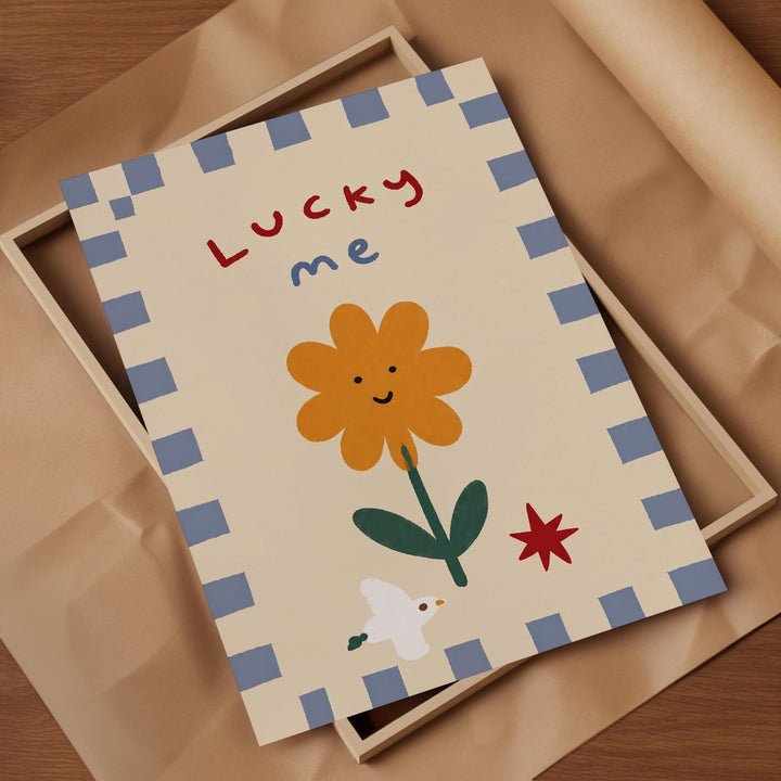 a colorful card with a flower and a bird, along with the text "Lucky me" written on it.