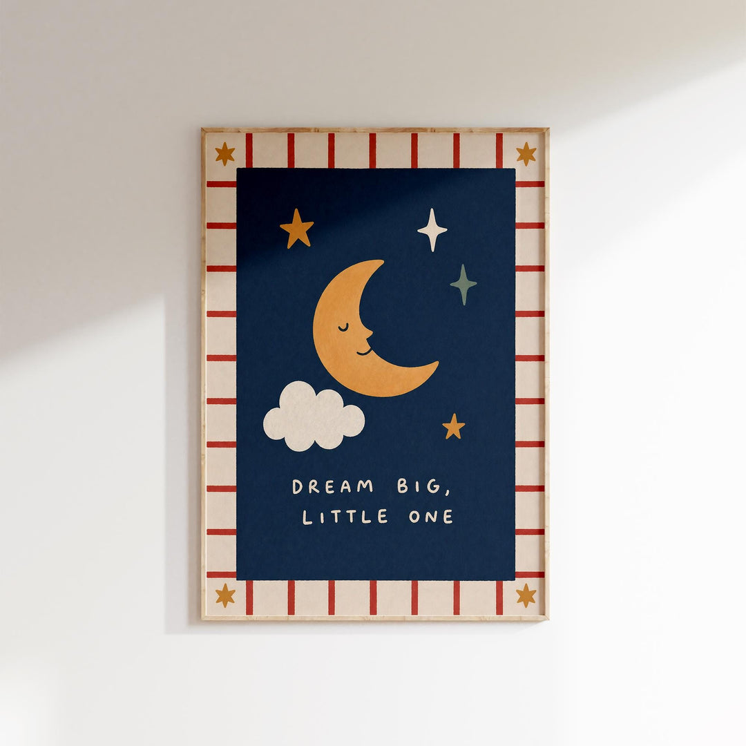 The image is a framed poster with a crescent moon, stars, and a cloud, along with the text "DREAM BIG, LITTLE ONE" written below.