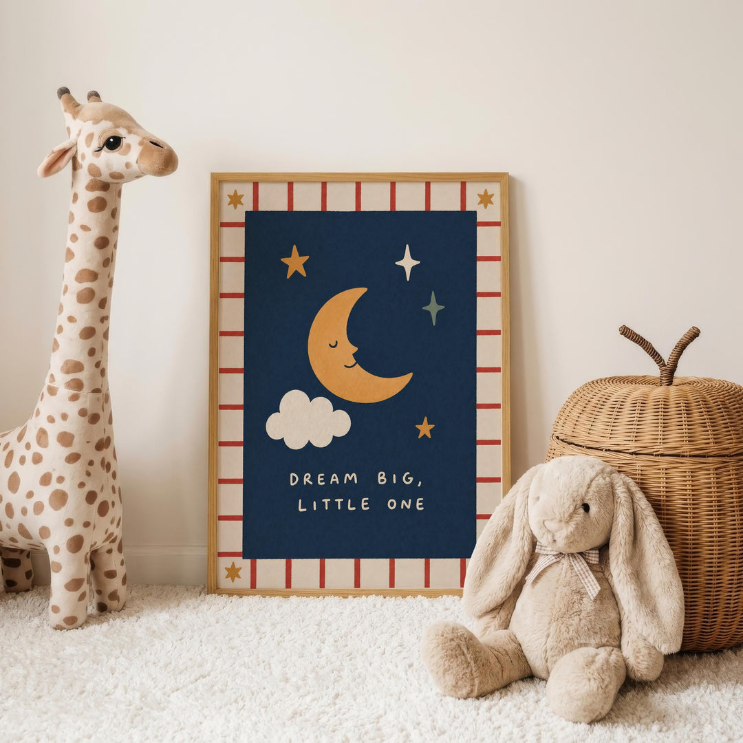 a giraffe, a stuffed rabbit, and a wicker basket, all arranged on a white carpet. In the background, there is a framed poster with a crescent moon and stars, along with the text "DREAM BIG, LITTLE ONE".