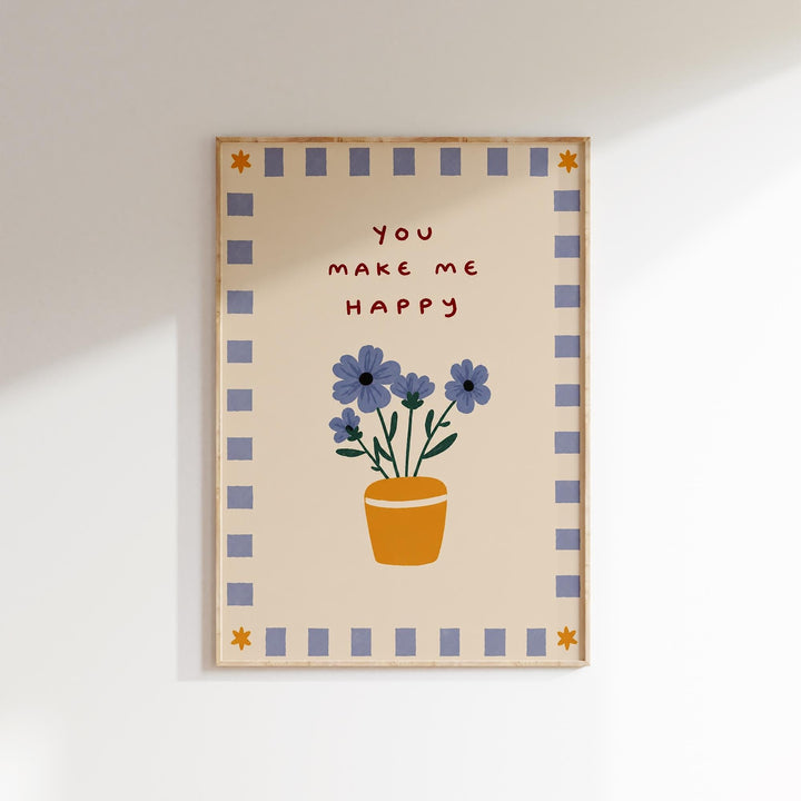 The image is a framed print with a floral design and the text "You make me happy" written on it.