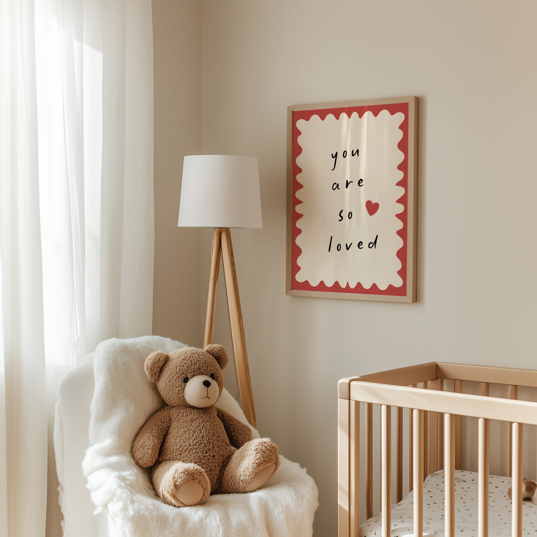 a teddy bear sitting in a chair next to a crib