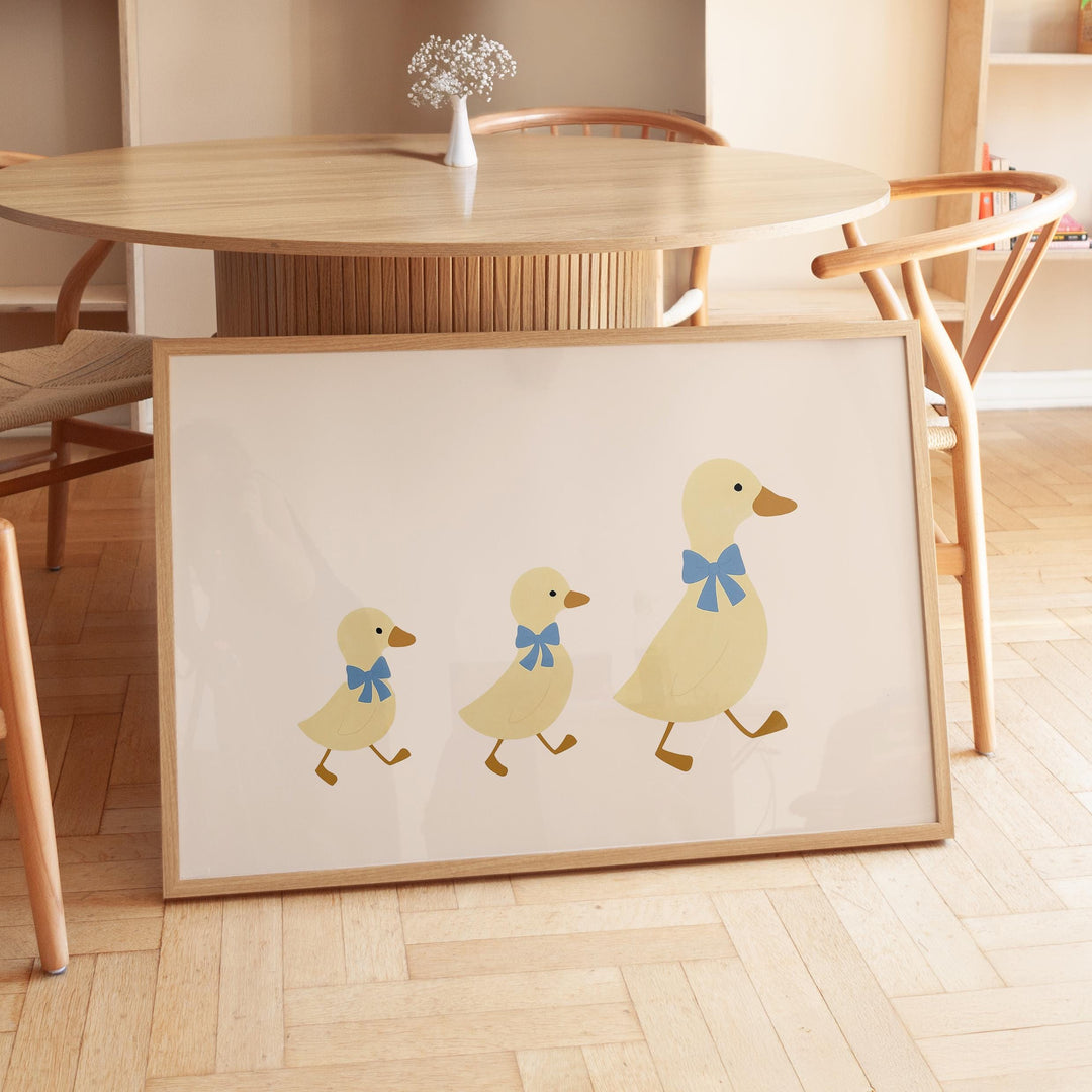 a picture of three ducks on a table
