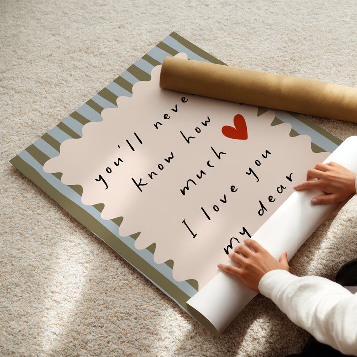 a child is holding a roll of paper with a message on it