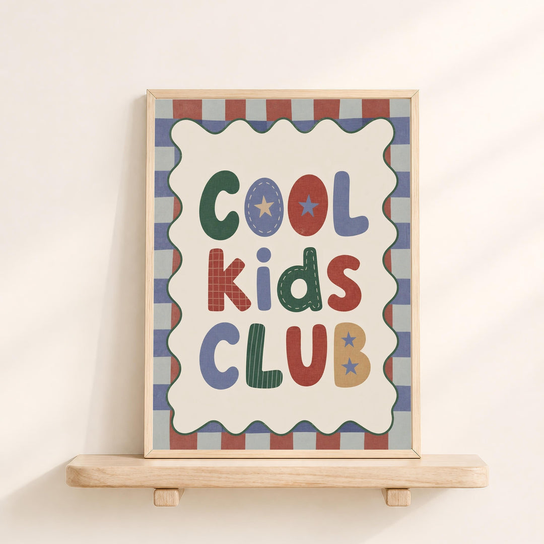 a framed sign with the text "Cool Kids Club" displayed on it.