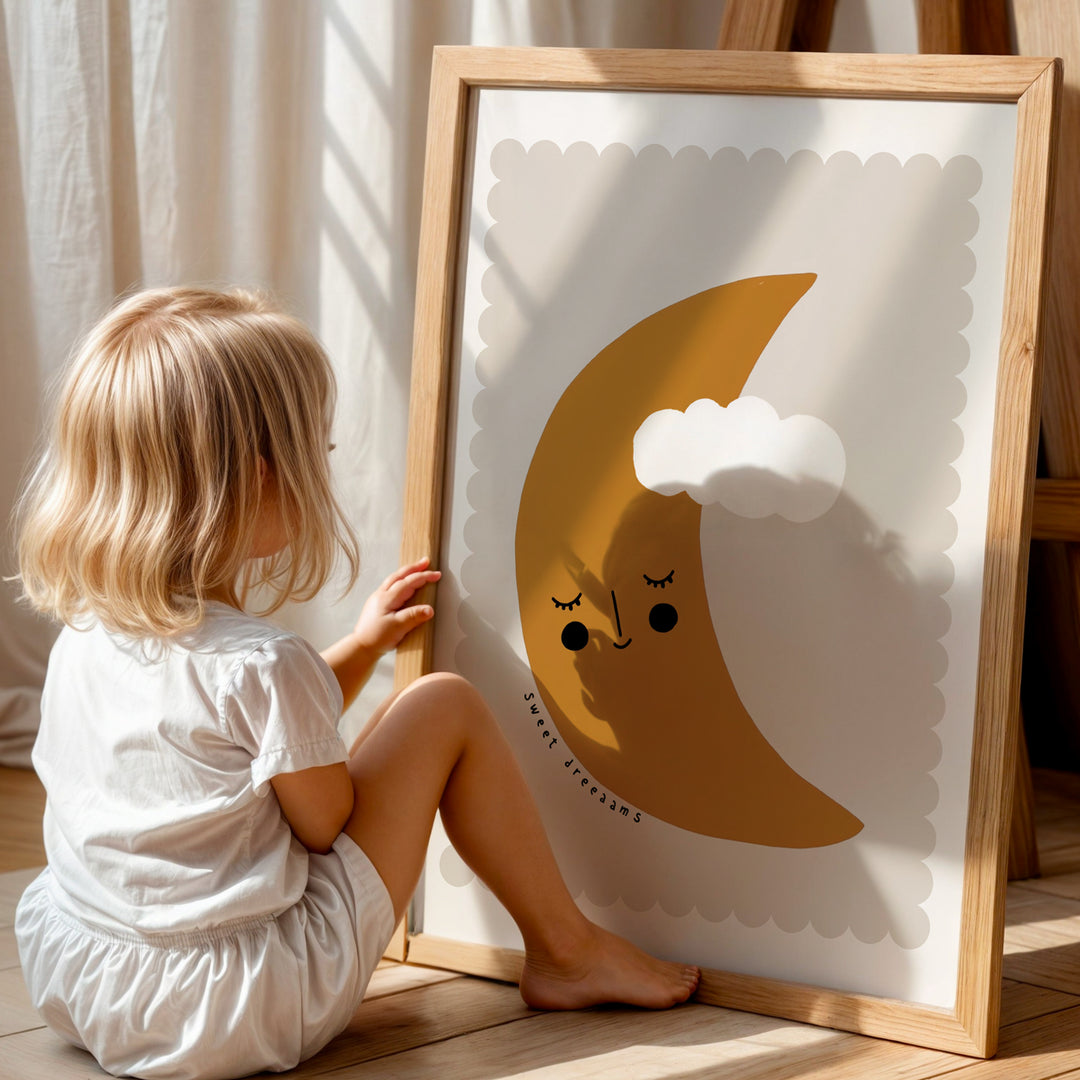a little girl sitting on the floor next to a picture