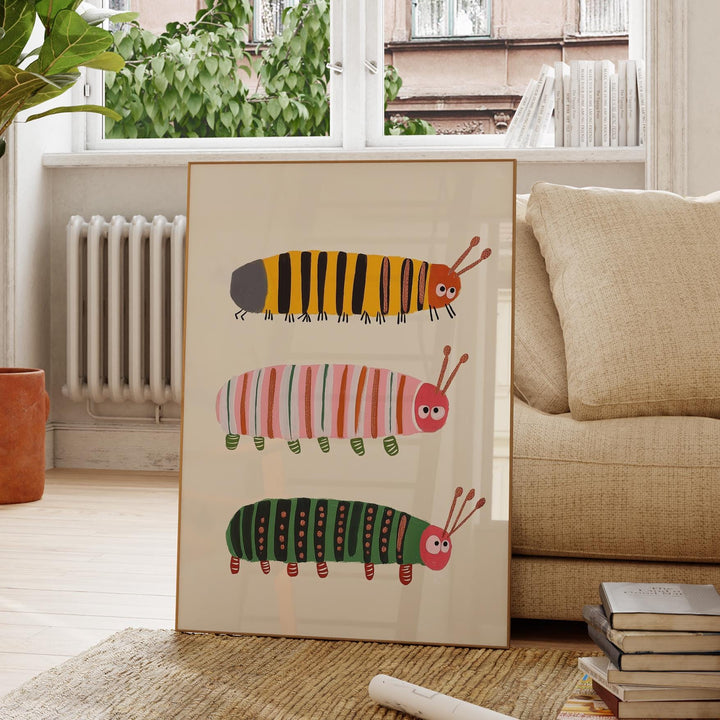 a picture frame with a picture of a group of caterpillars