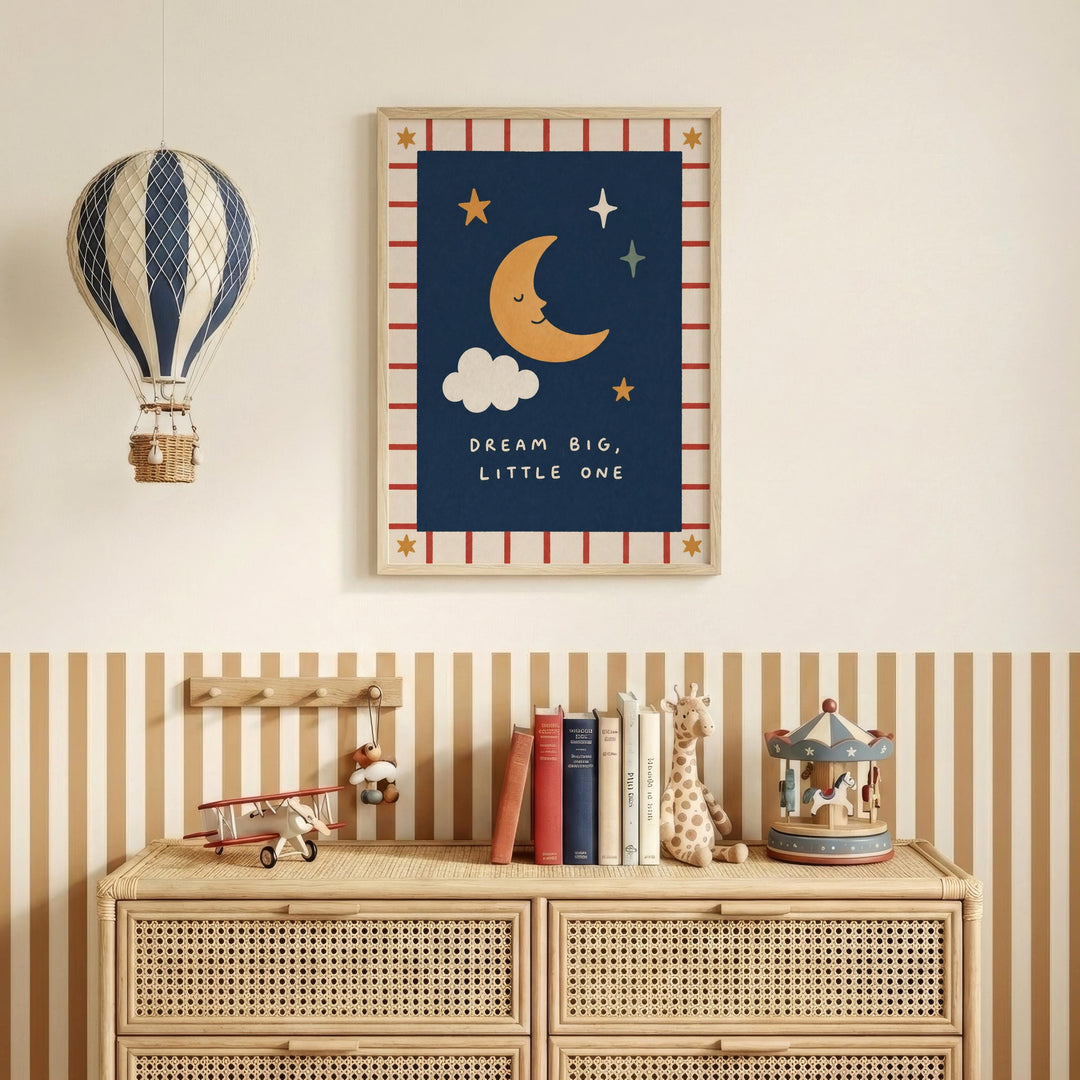 a wall with a framed poster of a crescent moon and stars, a hot air balloon, and a shelf with books and toys.