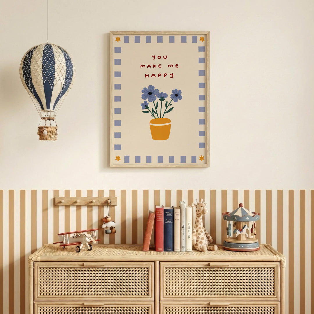 a wall with a framed poster that says "You make me happy" above a wooden dresser with a toy airplane and a carousel.