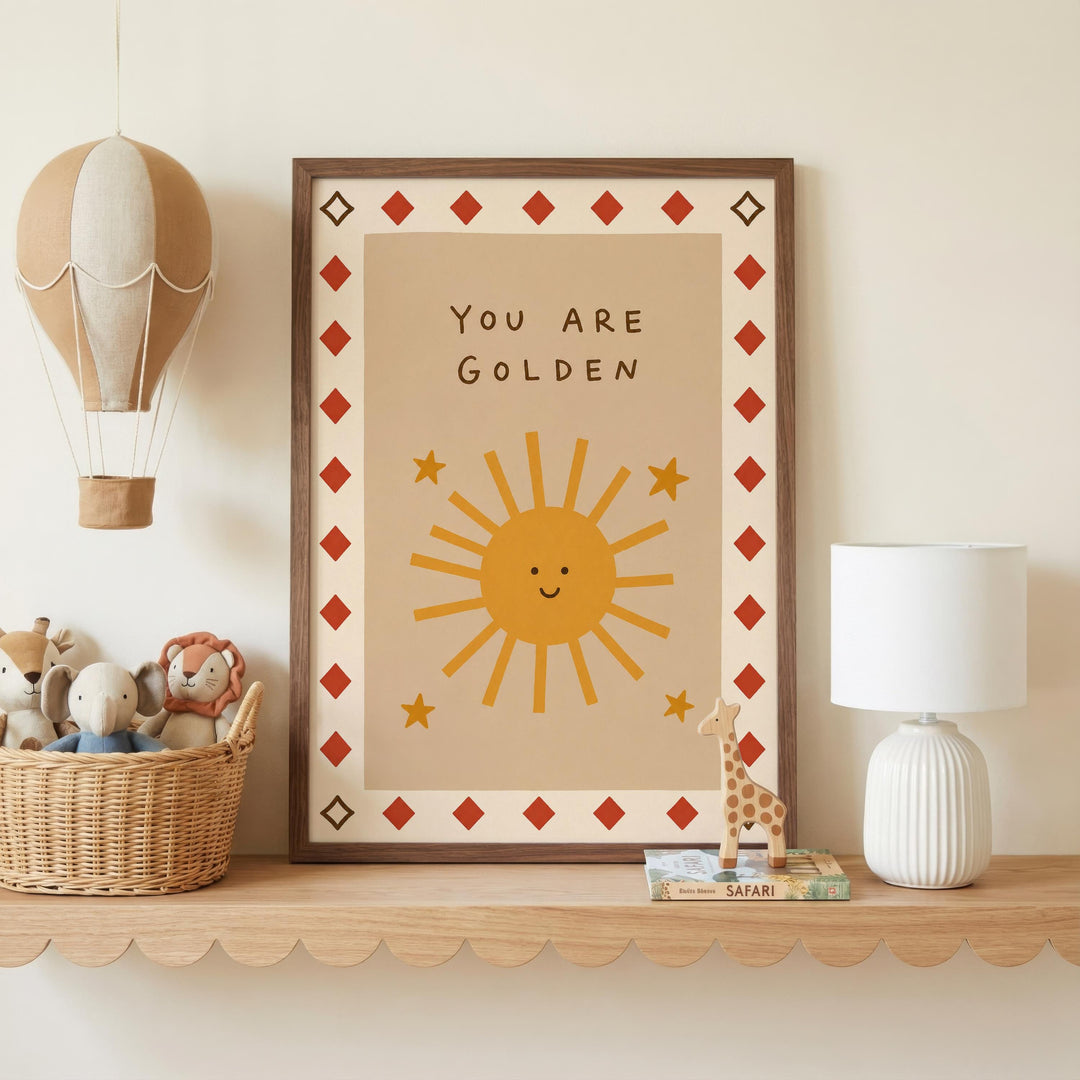 a framed poster with a sun and stars design, a hot air balloon, a basket of stuffed animals, and a lamp on a shelf.